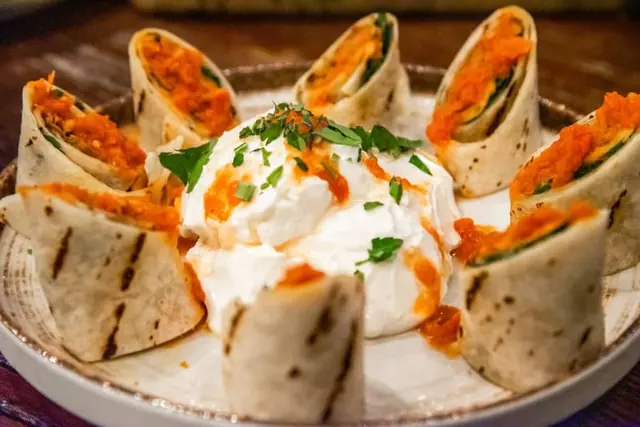 Share-style platter with seafood and garnish