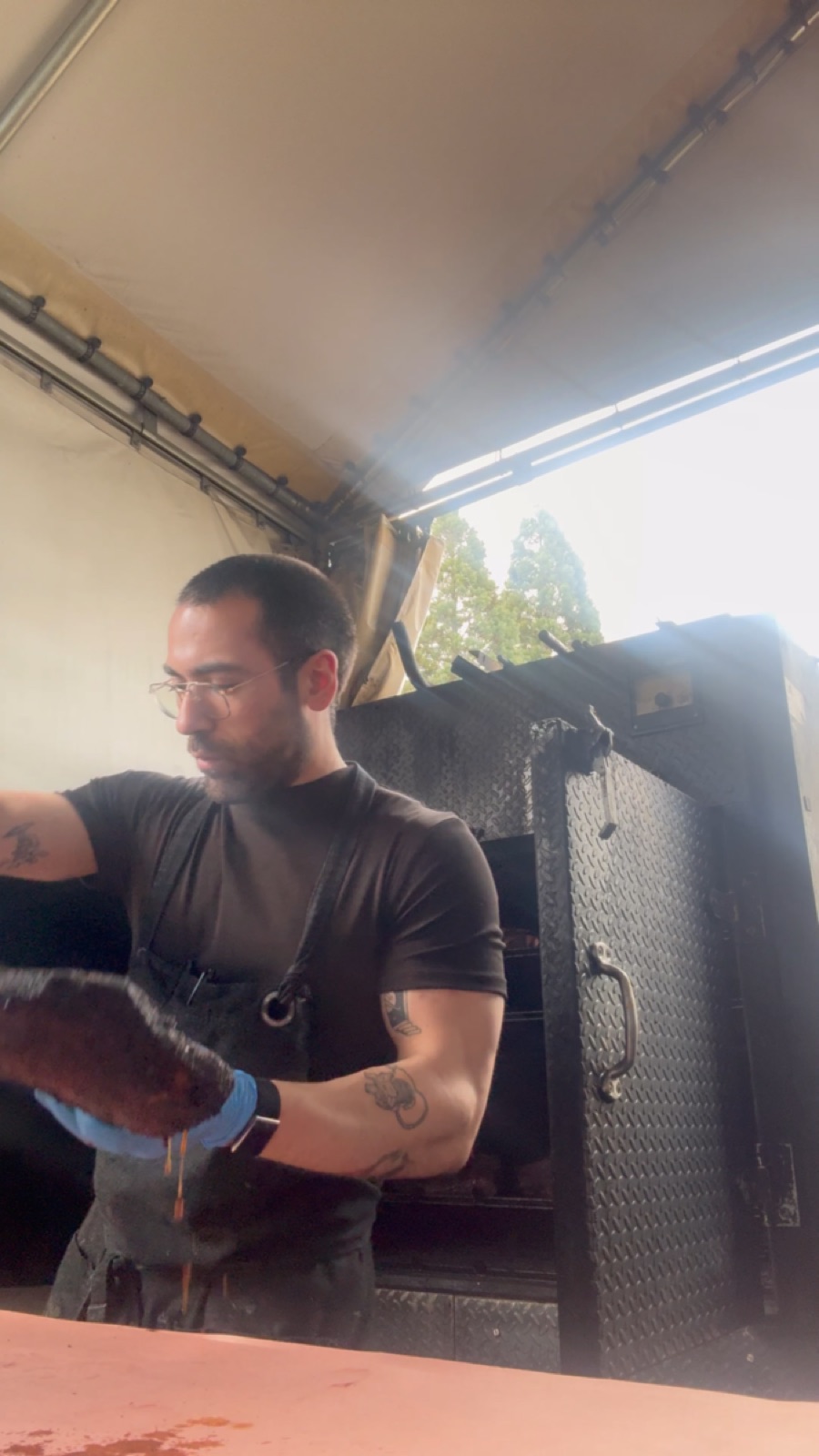 Chef Siler working beside the smoker